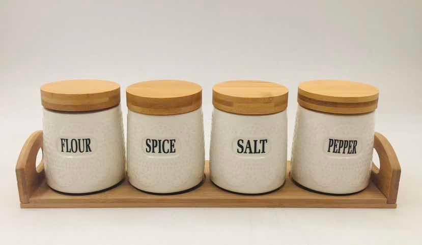 4-Piece Smooth Round Ceramic Spice Jar Set with Bamboo Lids on Bamboo Tray