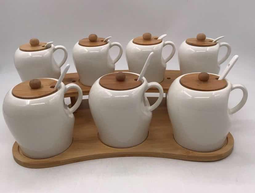 7-Piece Handled Ceramic Spice Pot Set with Bamboo Lids on Tray
