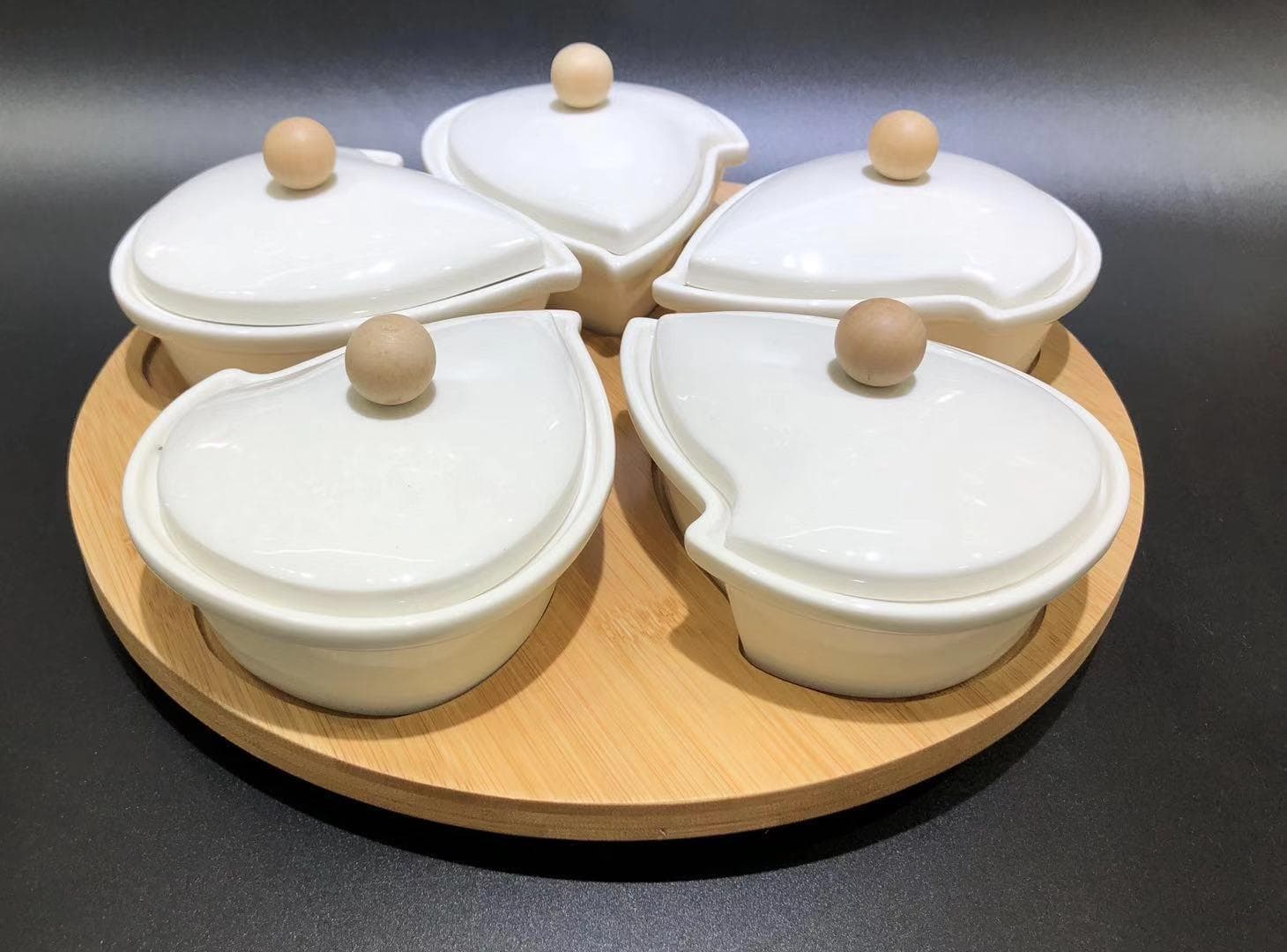 5-Piece Ceramic Serving Bowl Set with Bamboo Lids on Rotating Base