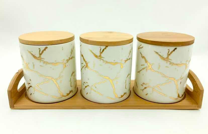 3-Piece White and Gold Marble-Effect Ceramic Canister Set with Bamboo Lids on Bamboo Tray