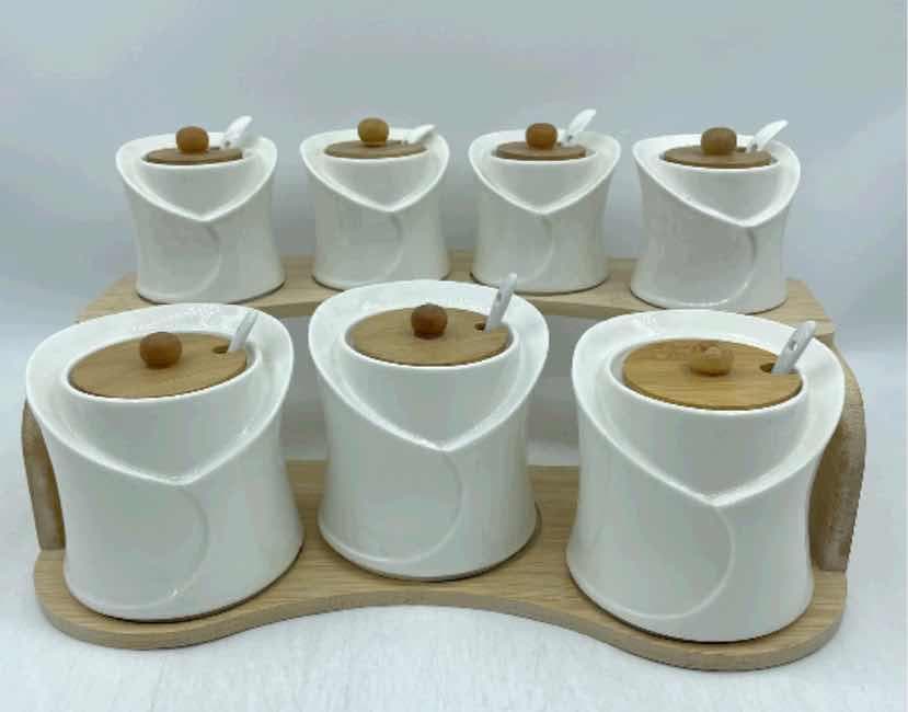 8-Piece Ceramic Spice Pot Set with Bamboo Lids and Spoons on Bamboo Tray