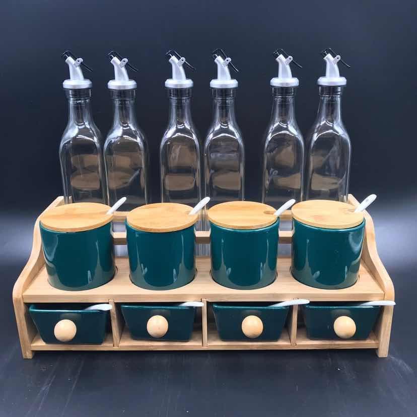 6-Bottle Glass Oil Set with Green Ceramic Jars and Drawers on Wooden Rack