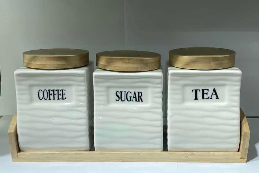 3-Piece Wave-Textured Ceramic Canister Set with Gold Lids on Bamboo Tray