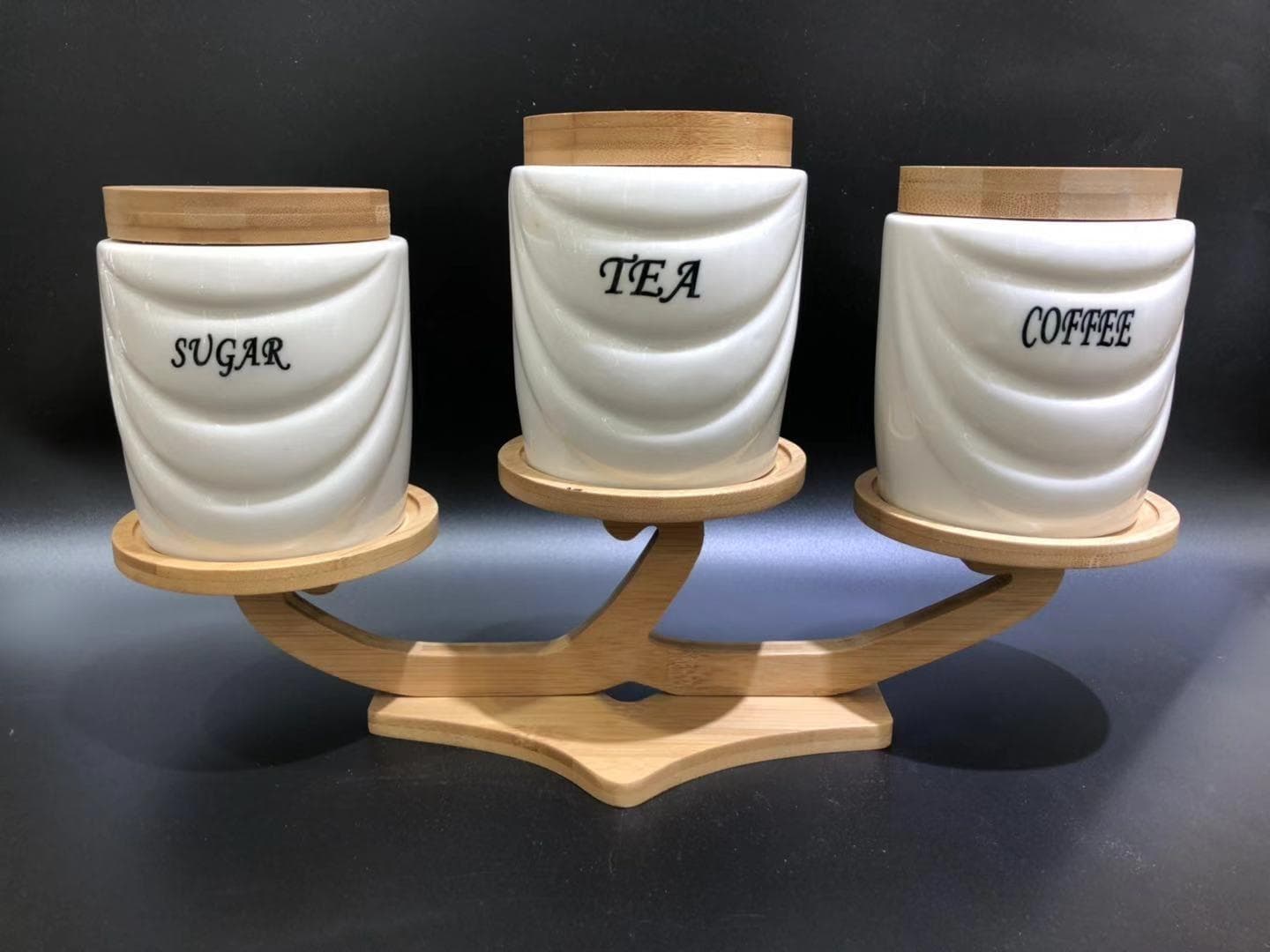 3-Piece Labelled Ceramic Canister Set with Bamboo Lids on Curved Bamboo Stand