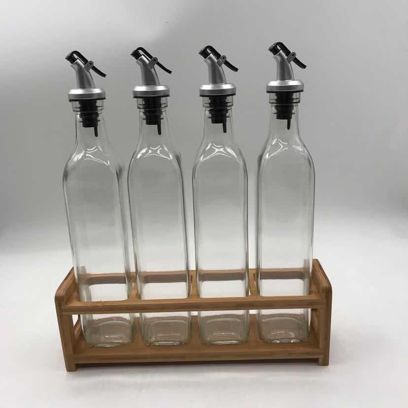 4-Piece Glass Oil Bottle Set with Pourers on Bamboo Rack