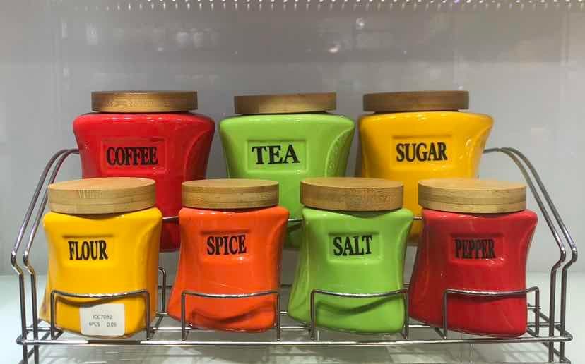 7-Piece Coloured Ceramic Canister Set with Handles on Two-Tier Metal Rack