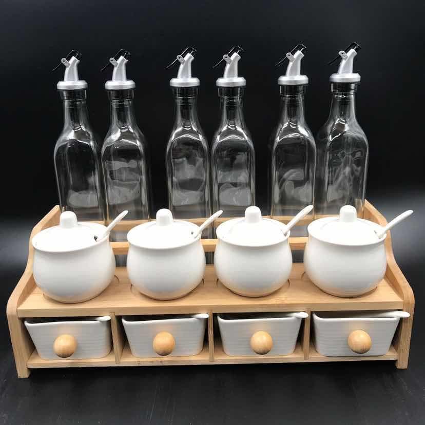6-Bottle Glass Oil Set with White Ceramic Condiment Jars and Drawers on Wooden Rack
