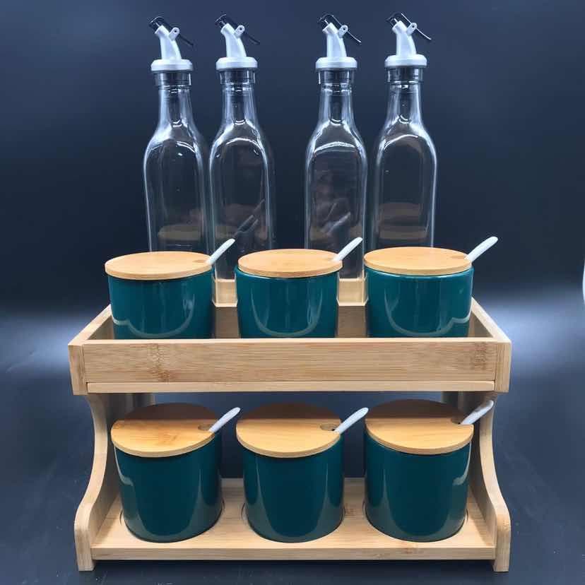 Glass Oil Bottle and Green Ceramic Condiment Jar Set on Two-Tier Wooden Rack
