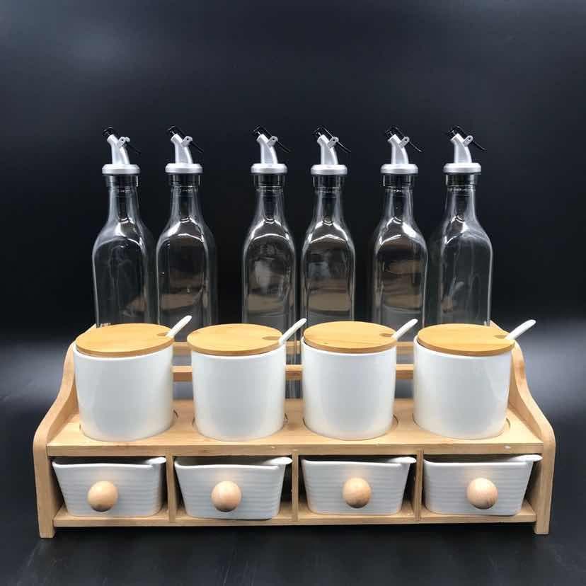 6-Bottle Glass Oil Set with White Ceramic Jars and Drawers on Wooden Rack