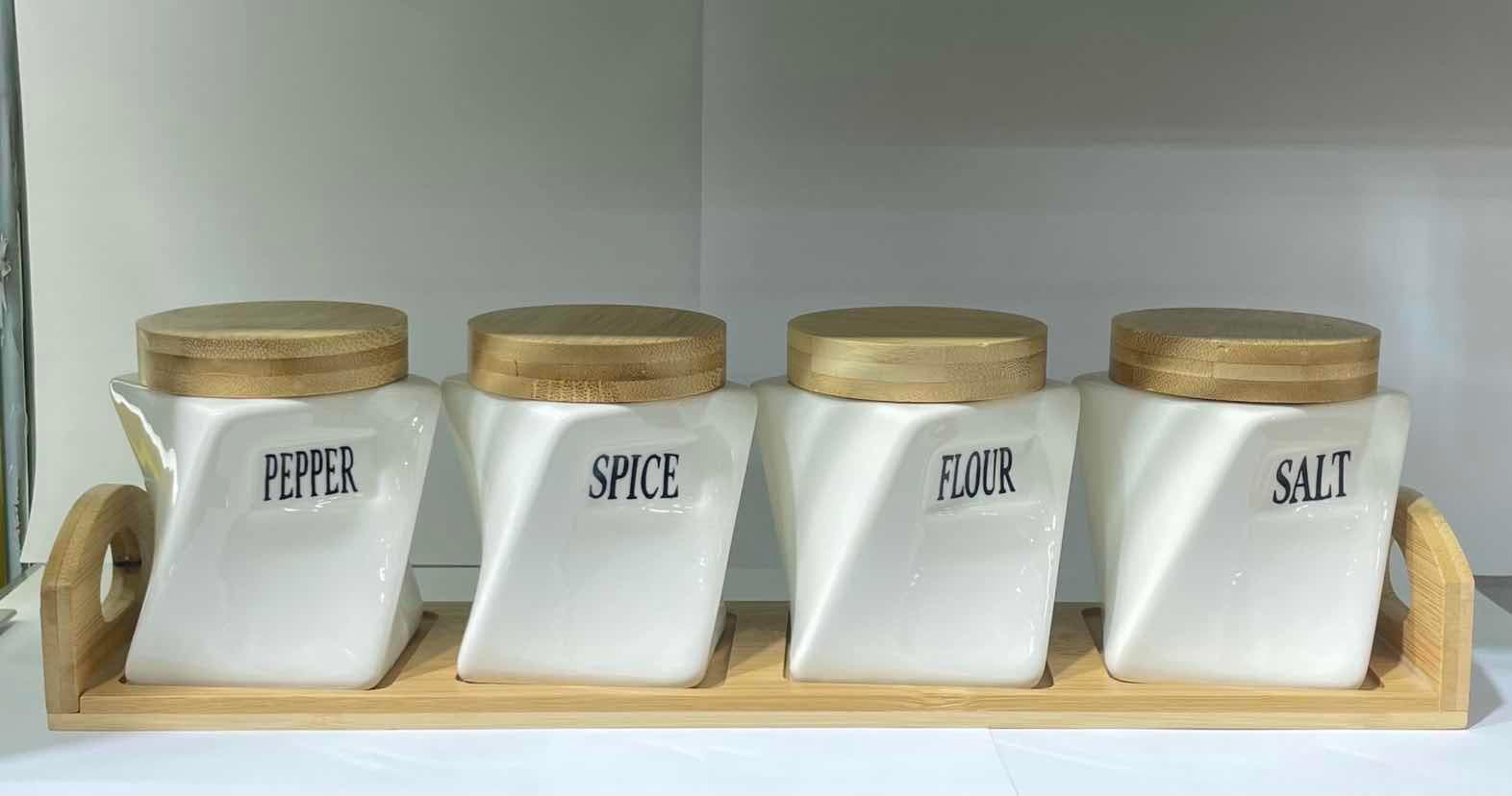 4-Piece Square Tapered Ceramic Spice Jar Set with Bamboo Lids on Bamboo Tray
