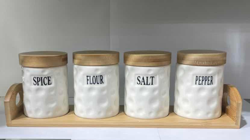 4-Piece Hammered Ceramic Spice Jar Set with Bamboo Lids on Bamboo Tray