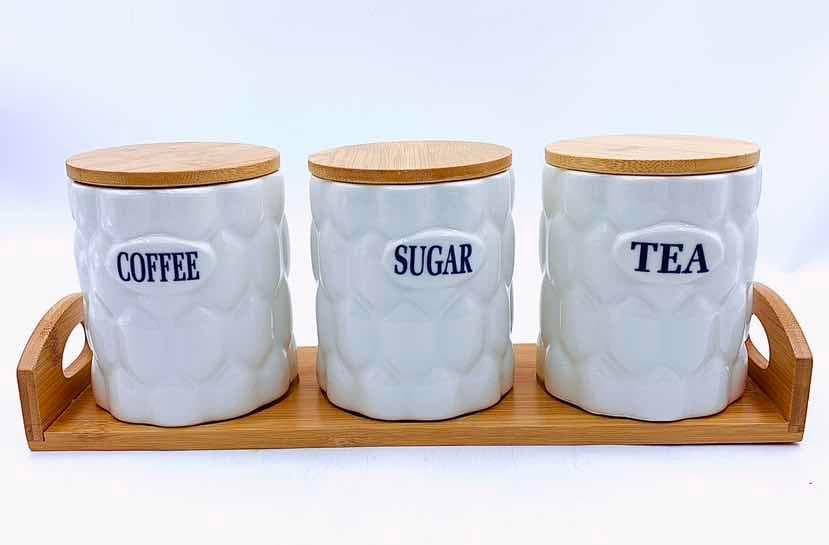 3-Piece Dimpled Ceramic Canister Set with Bamboo Lids on Bamboo Tray