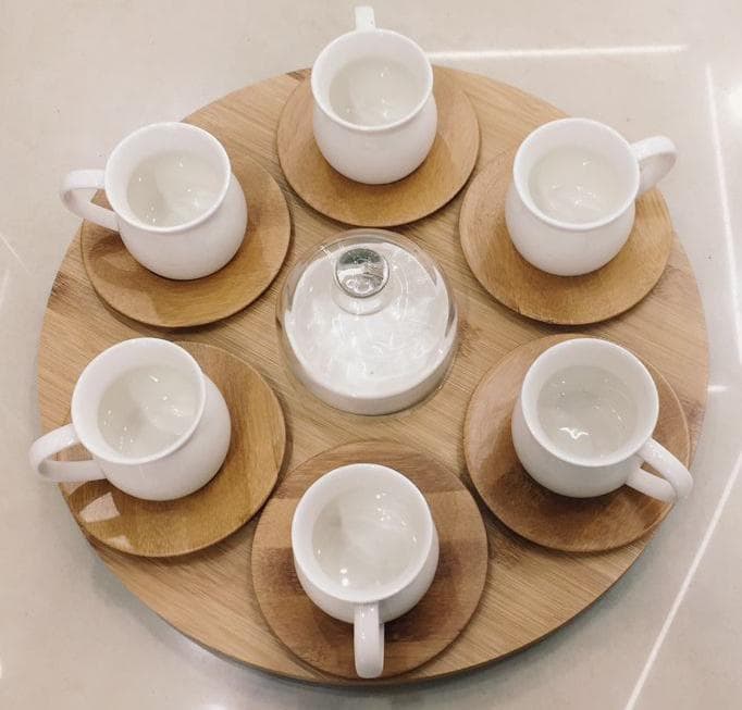 6-Piece Ceramic Cup and Saucer Set with Lidded Jar on Round Bamboo Tray