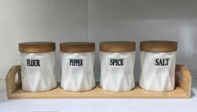 4-Piece Faceted Ceramic Spice Jar Set with Bamboo Lids on Bamboo Tray