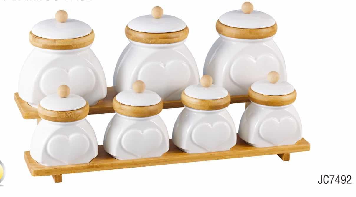 7-Piece Embossed Ceramic Canister Set with Bamboo Lids on Two-Tier Rack