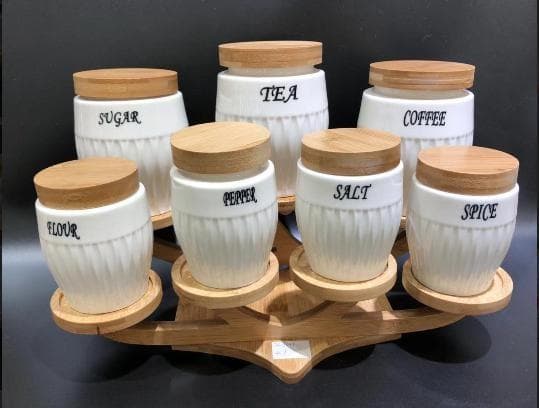 7-Piece Labelled Ceramic Canister and Spice Set with Bamboo Lids on Curved Bamboo Stand