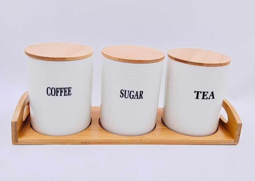 3-Piece Smooth Round Ceramic Canister Set with Bamboo Lids on Bamboo Tray