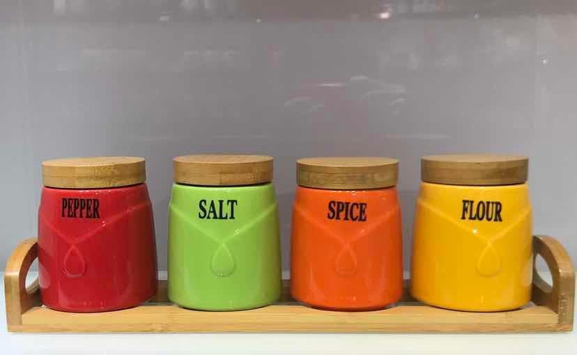 4-Piece Coloured Ceramic Spice Jar Set with Bamboo Lids on Bamboo Tray