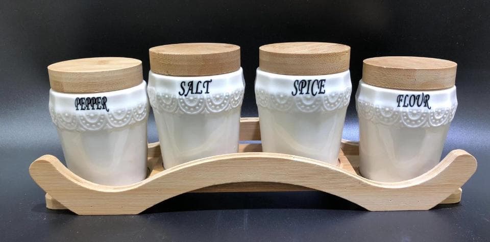 4-Piece Lace-Pattern Ceramic Spice Jar Set with Bamboo Lids on Arched Bamboo Stand